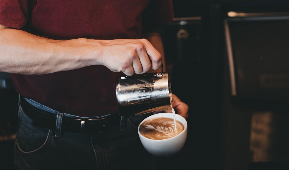 Barista pouring latte art