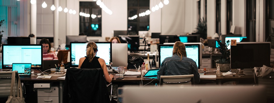 An office filled with people with a coffee machine